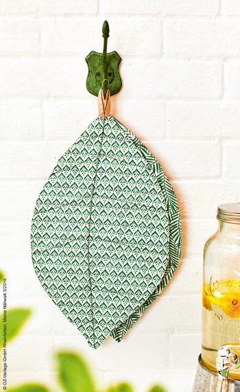 Modische, handgemachte Blattform in grünem Musterdesign, geometrisch und originell.