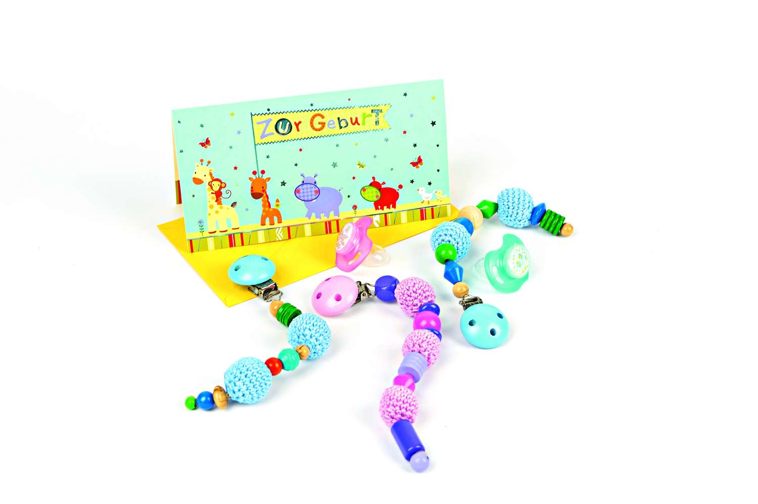 Handgemachte Babyketten mit bunten Perlen und Clips, pastellige Töne, ideal als Geschenk, DIY-Design.