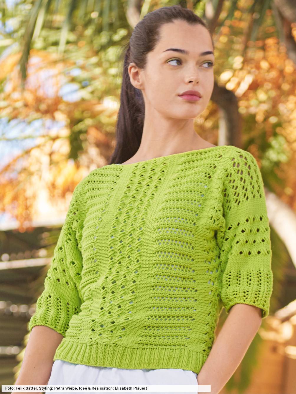 Modischer, handgemachter grüner Strickpullover mit luftigen Mustern und lockerem Schnitt, DIY-Style.