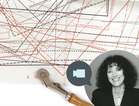 Bunte Schnittmuster auf Papier, modisch, DIY, mit Rollschneider für präzise Handarbeit.