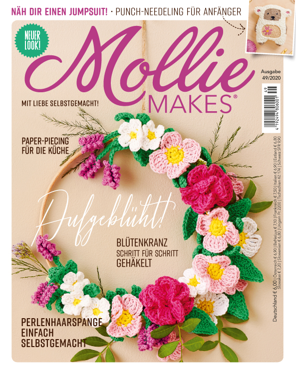 Häkelblumenkranz in pink, weiß & grün, handgemacht, DIY-Charme, detailverliebt, farbenfrohes Crafting-Highlight.