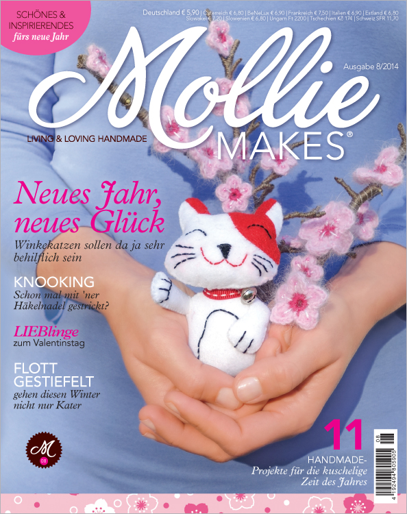 Modische, handgemachte Stoffkatze in fröhlichen Farben und niedlichem Design, ideal als DIY-Projekt.