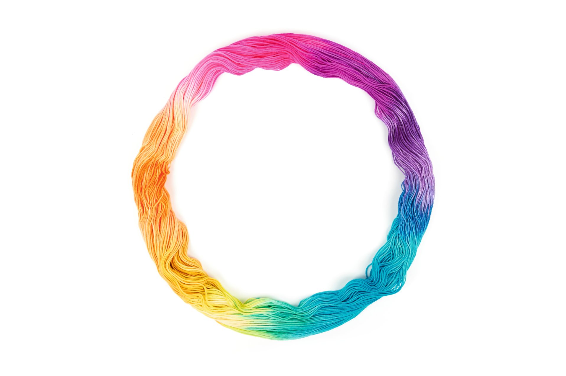 Bunte Garnschleife: Übergang von Pink zu Türkis. Perfekt für DIY-Projekte und Handarbeit.